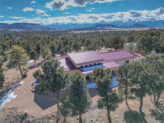 aerial view featuring a mountain view and a wooded view