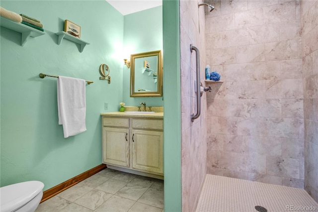 full bath with baseboards, toilet, a shower stall, and vanity