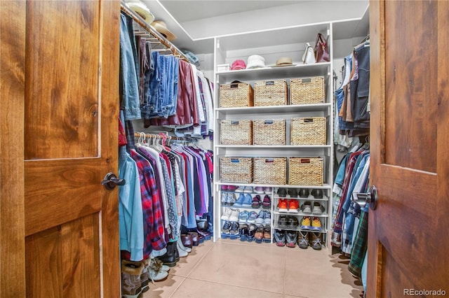 walk in closet with tile patterned flooring