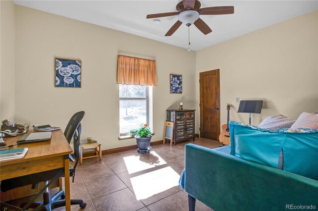 office featuring ceiling fan, baseboards, and tile patterned flooring