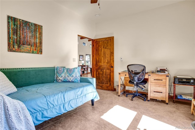 bedroom with light tile patterned floors and a ceiling fan