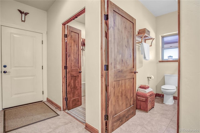 interior space featuring baseboards