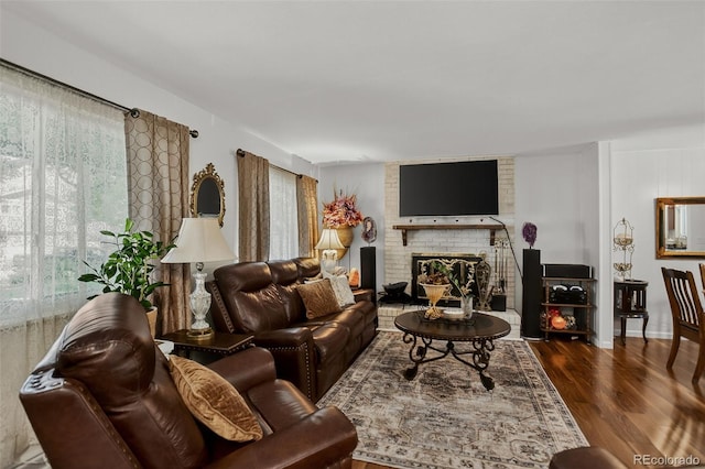 6416 Zang Ct, Arvada, CO 80004 - living room with wood finished floors and a brick fireplace