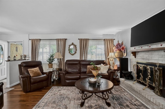6416 Zang Ct, Arvada, CO 80004 - living area with healthy amount of natural light, wood finished floors, and a fireplace