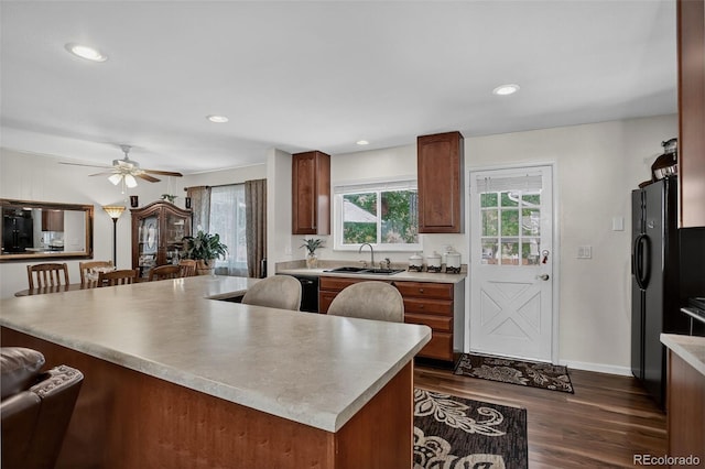 6416 Zang Ct, Arvada, CO 80004 - kitchen featuring plenty of natural light, dark wood finished floors, light countertops, a ceiling fan, and recessed lighting