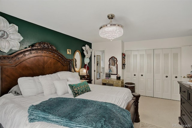 6416 Zang Ct, Arvada, CO 80004 - bedroom with light colored carpet, a chandelier, and a closet