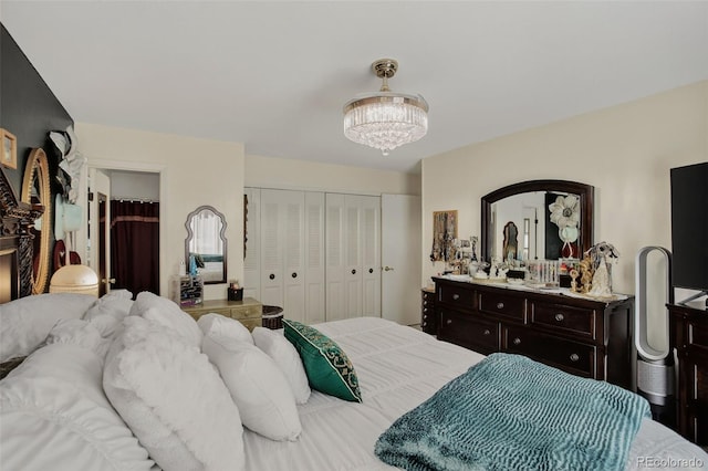 6416 Zang Ct, Arvada, CO 80004 - bedroom featuring a closet and a chandelier