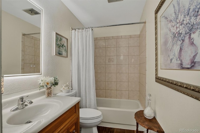 6416 Zang Ct, Arvada, CO 80004 - bathroom featuring vanity, shower / tub combo with curtain, a textured wall, and wood finished floors