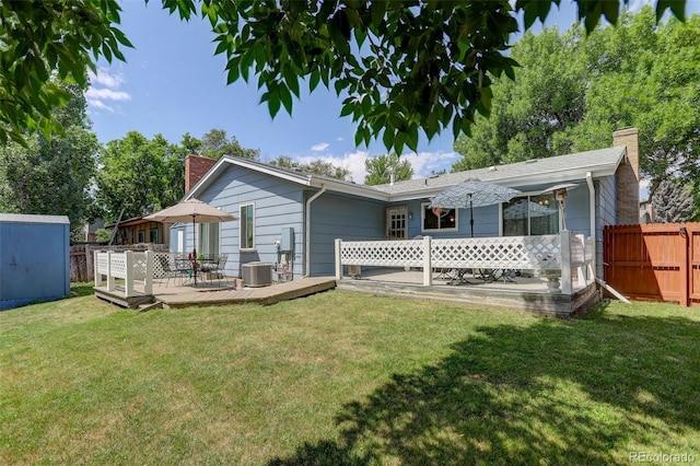6416 Zang Ct, Arvada, CO 80004 - rear view of house featuring a chimney, a deck, and a shed