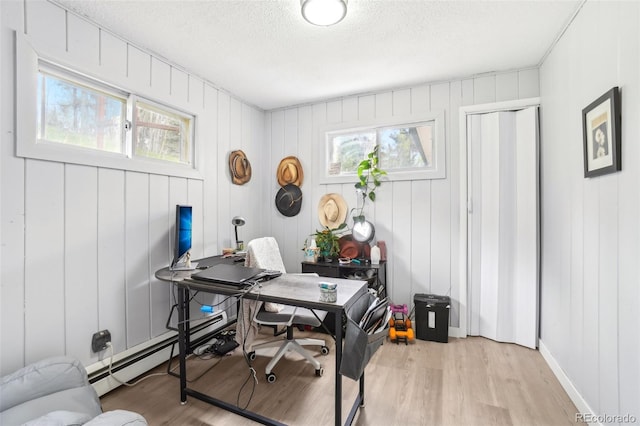 11827 Brook Rd, Golden, CO 80403 - office featuring a textured ceiling, light wood-style floors, and a baseboard heating unit