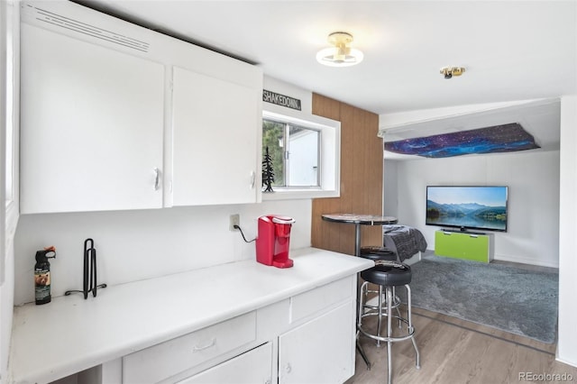 11827 Brook Rd, Golden, CO 80403 - kitchen with white cabinets, light wood-style floors, and light countertops