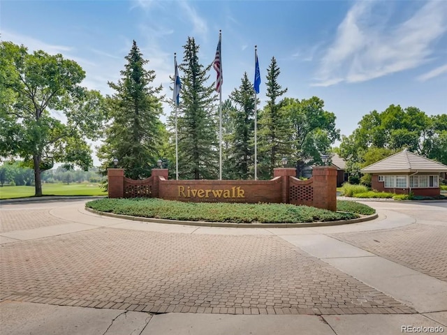 2951 W Riverwalk Cir Unit N, Littleton, CO 80123 - community sign with curved driveway