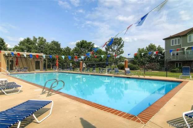 2951 W Riverwalk Cir Unit N, Littleton, CO 80123 - community pool with fence and a patio