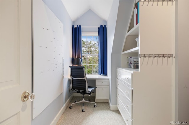 office area with lofted ceiling, baseboards, and light colored carpet