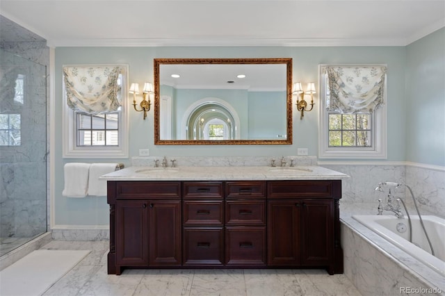 bathroom featuring a bath, marble finish flooring, double vanity, and ornamental molding