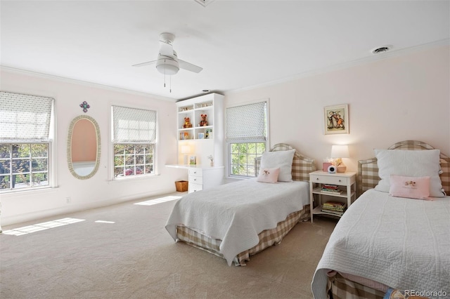 bedroom featuring ornamental molding, multiple windows, carpet, and a ceiling fan