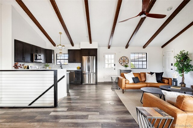 living room with beam ceiling, a ceiling fan, dark wood-style flooring, and high vaulted ceiling