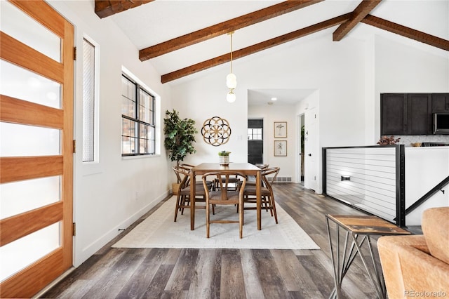 dining space with dark wood finished floors, beam ceiling, visible vents, and high vaulted ceiling