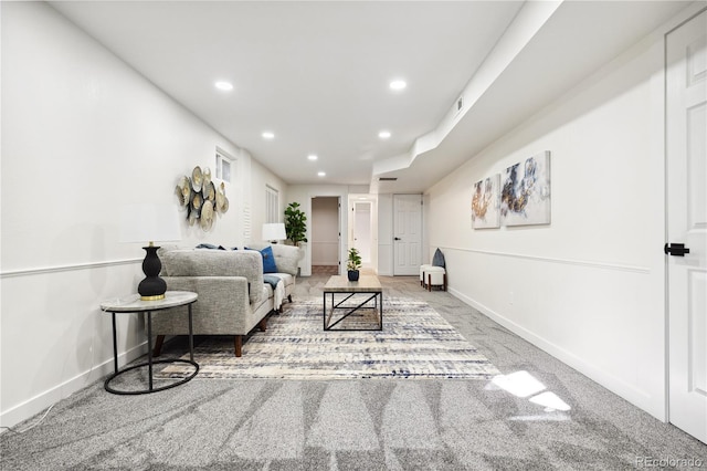 carpeted living room featuring recessed lighting and baseboards