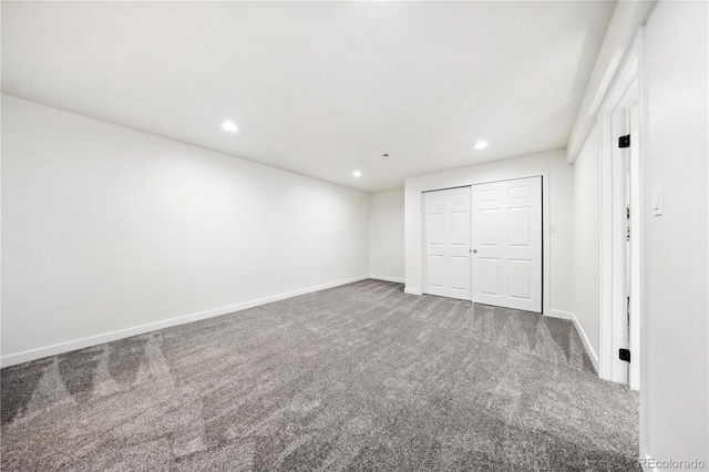 unfurnished bedroom with recessed lighting, carpet, baseboards, and a closet