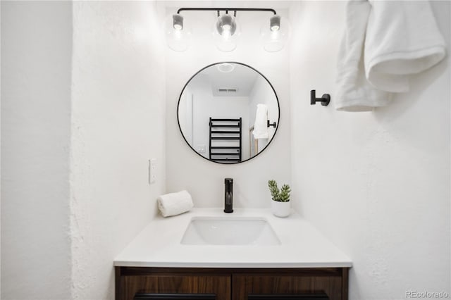 bathroom featuring visible vents and vanity