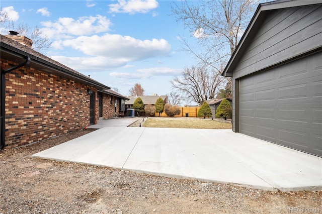 exterior space featuring fence and dirt driveway