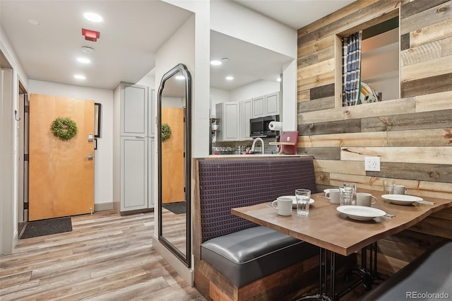645 S Park Ave Unit 302, Breckenridge, CO 80424 - dining space featuring light wood-type flooring, wood walls, and recessed lighting