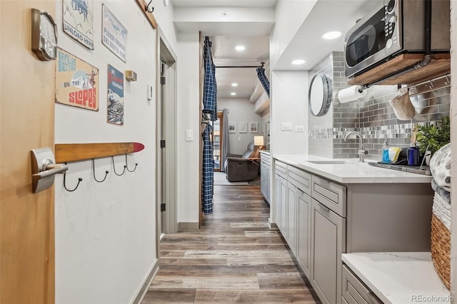 645 S Park Ave Unit 302, Breckenridge, CO 80424 - bathroom with wood finished floors, backsplash, vanity, recessed lighting, and baseboards