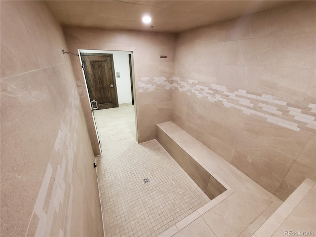 645 S Park Ave Unit 302, Breckenridge, CO 80424 - bathroom with tile walls, tile patterned flooring, and tiled shower