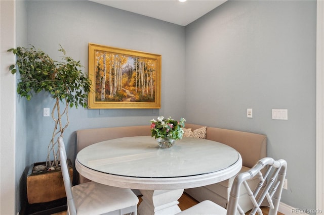 dining area featuring baseboards and recessed lighting