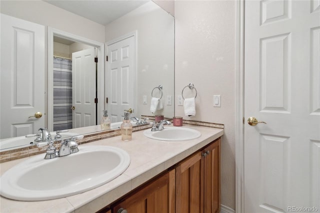 bathroom featuring double vanity