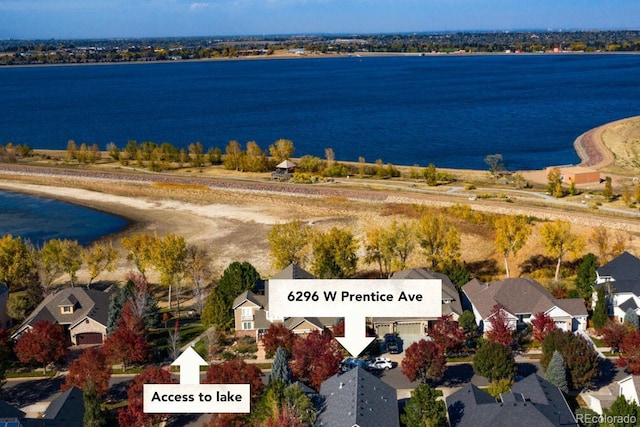 aerial perspective of suburban area featuring a nearby body of water