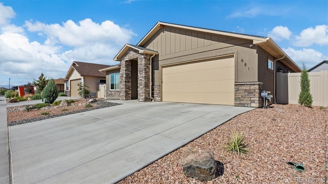 681 Eadin Ln, Grand Junction, CO 81504 - ranch-style home featuring stone siding, concrete driveway, and an attached garage