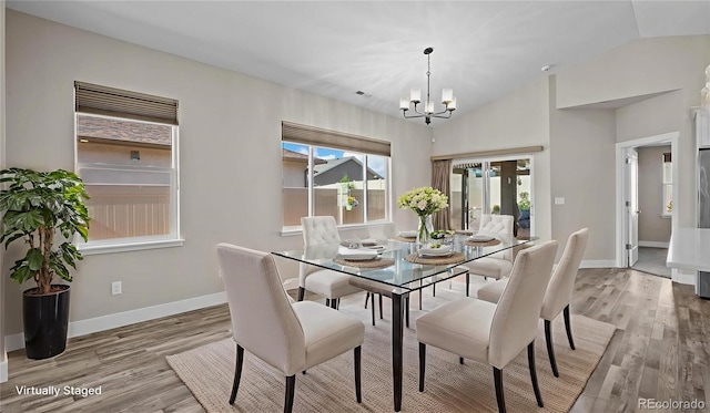 681 Eadin Ln, Grand Junction, CO 81504 - dining area featuring a chandelier, light wood-type flooring, and vaulted ceiling