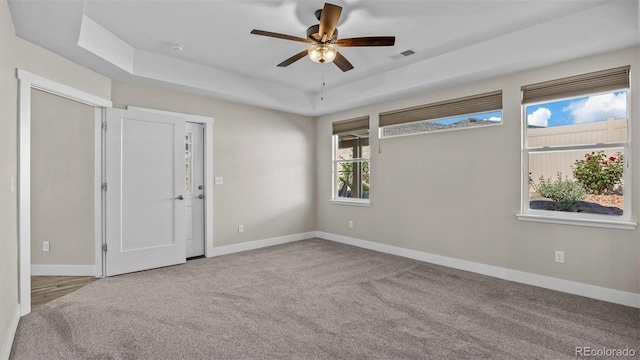 681 Eadin Ln, Grand Junction, CO 81504 - empty room featuring ceiling fan, carpet floors, and a tray ceiling