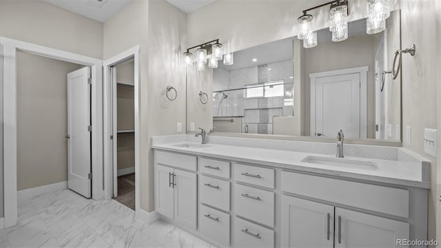 681 Eadin Ln, Grand Junction, CO 81504 - full bath featuring double vanity, a stall shower, marble look tile flooring, and a walk in closet