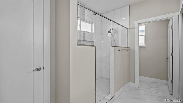 681 Eadin Ln, Grand Junction, CO 81504 - full bathroom featuring marble finish floors, plenty of natural light, and a marble finish shower