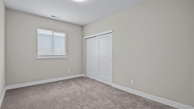 681 Eadin Ln, Grand Junction, CO 81504 - unfurnished bedroom featuring carpet floors and a closet