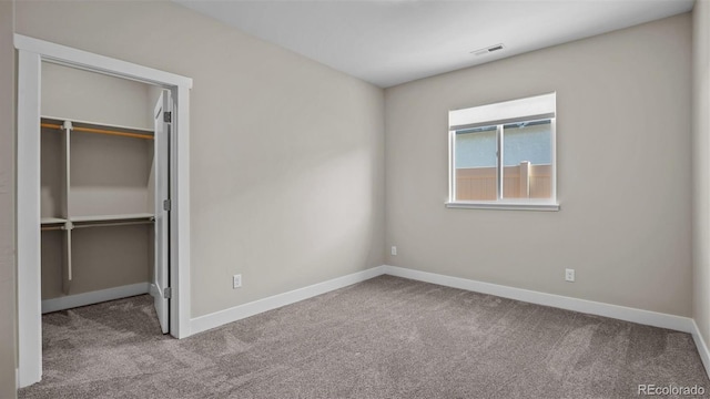 681 Eadin Ln, Grand Junction, CO 81504 - unfurnished bedroom featuring a walk in closet, carpet, and a closet