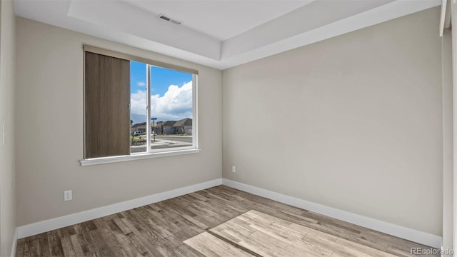 681 Eadin Ln, Grand Junction, CO 81504 - unfurnished room featuring wood finished floors and a raised ceiling