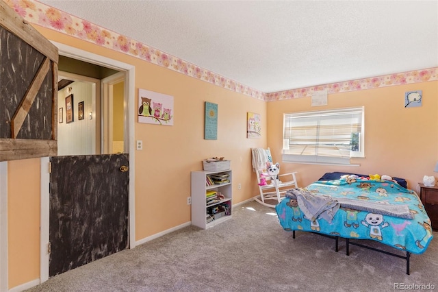 bedroom featuring carpet flooring, baseboards, and a textured ceiling