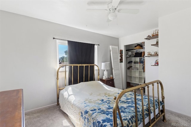 bedroom featuring ceiling fan, carpet, a closet, and baseboards