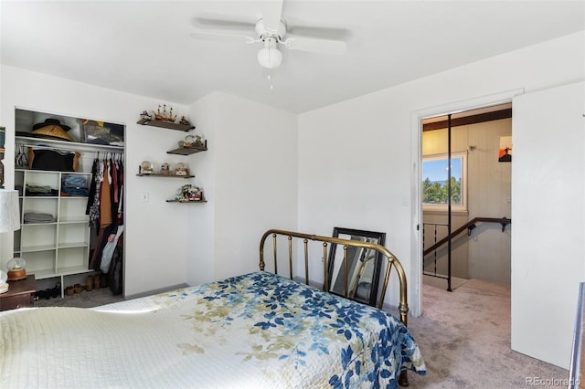 bedroom with a closet, carpet flooring, and a ceiling fan