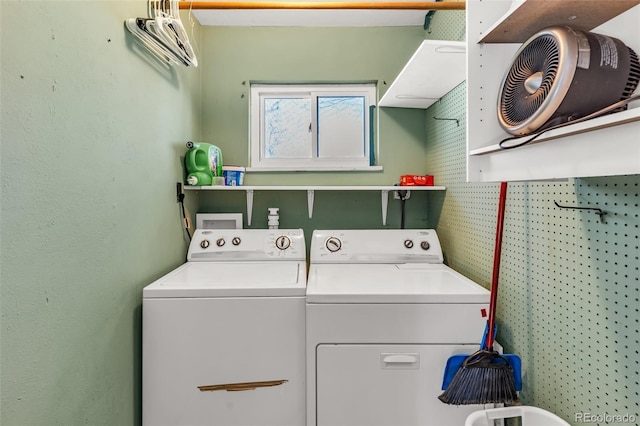 washroom with laundry area and separate washer and dryer