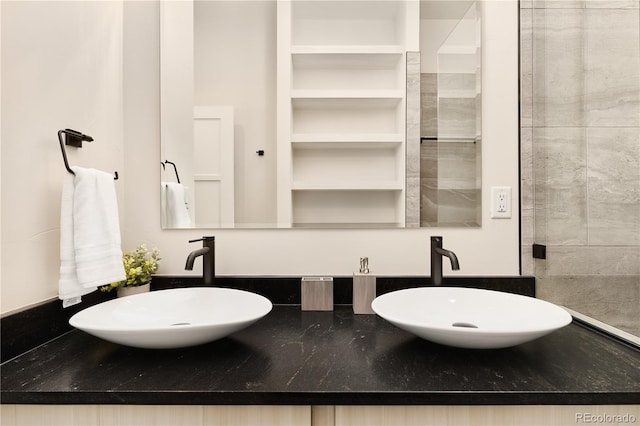 bathroom with double vanity and a sink