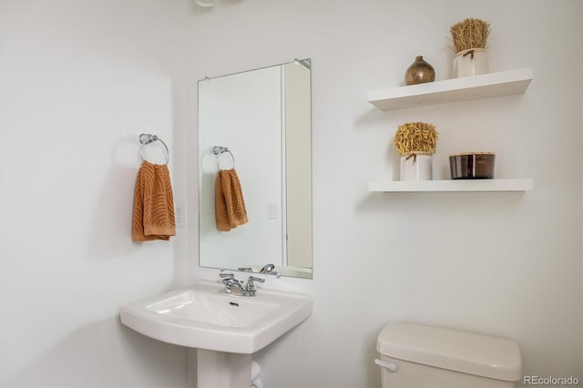16568 W 92nd Pl, Arvada, CO 80007 - half bathroom featuring toilet and a sink