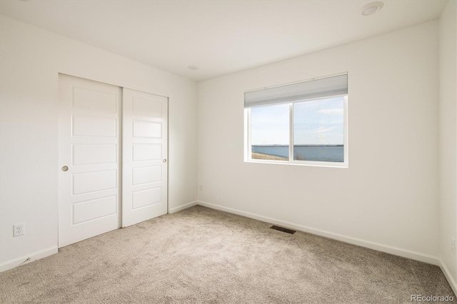 16568 W 92nd Pl, Arvada, CO 80007 - unfurnished bedroom featuring carpet floors and a closet