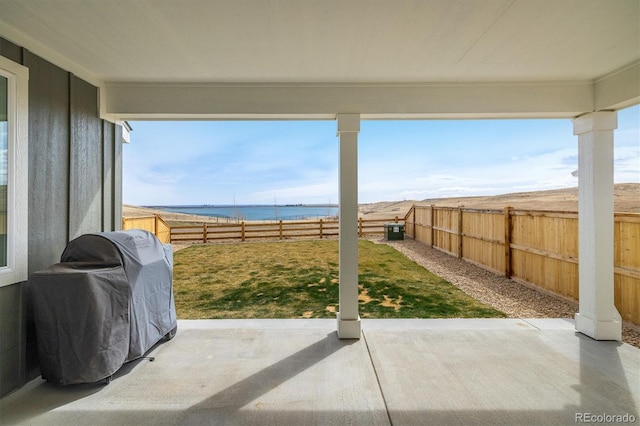 16568 W 92nd Pl, Arvada, CO 80007 - fenced backyard with a water view, area for grilling, and a patio area