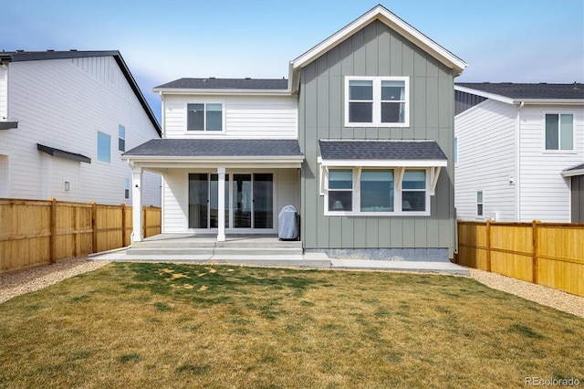 16568 W 92nd Pl, Arvada, CO 80007 - rear view of house with a patio area, board and batten siding, and a fenced backyard