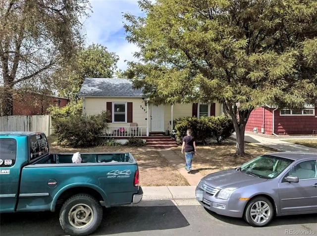 3477 S Marion St, Englewood, CO 80113 - obstructed view of property with a shingled roof